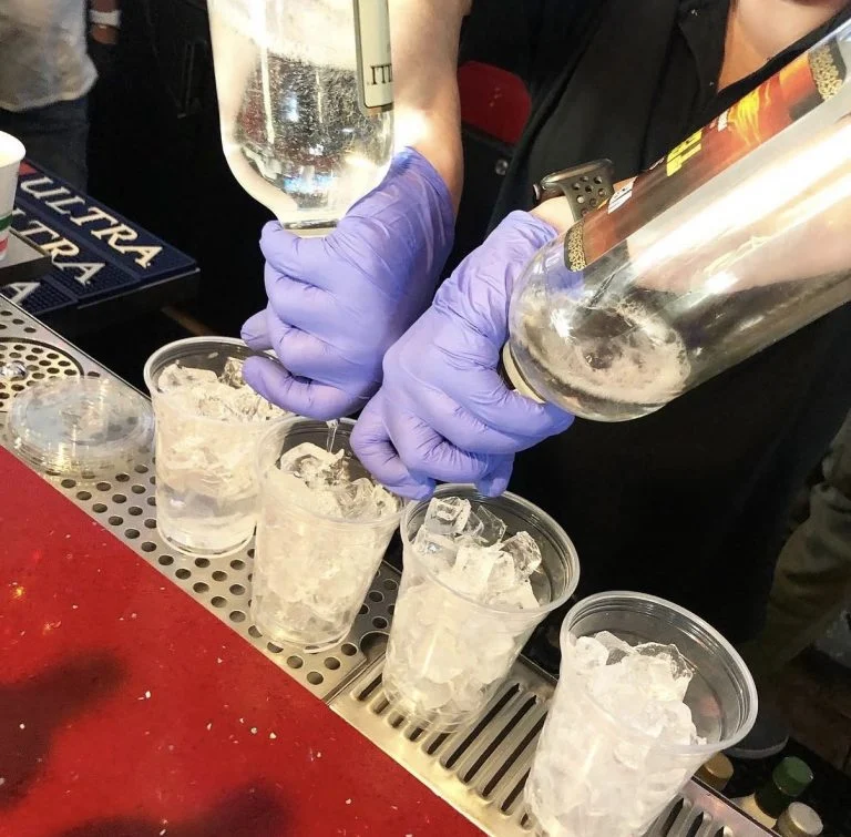 Drinks being poured at Rooster's Wings & Brew bar