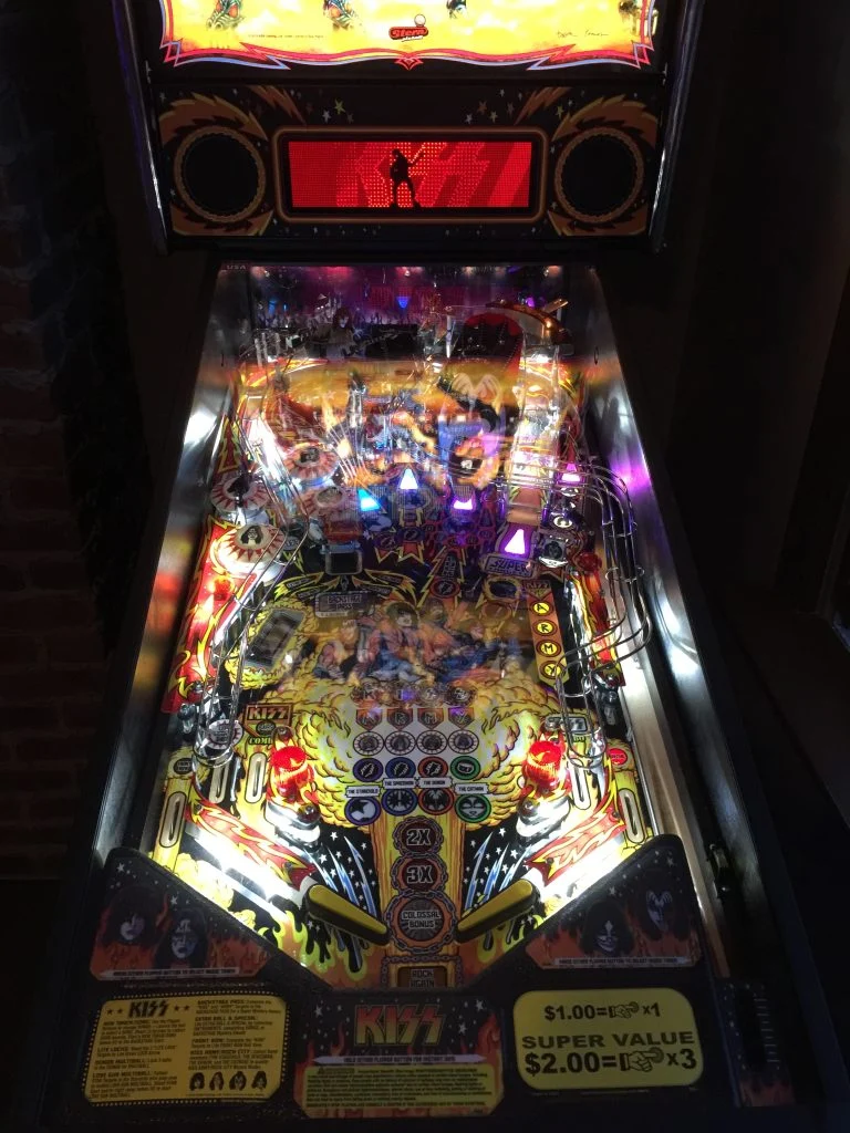 Illuminated KISS pinball playfield at Rooster's Wings & Brew in Mohegan Lake.