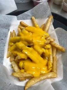 Cheese Fries at Rooster's Wings & Brew.