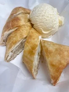 Warm Banana Cheesecake Pastry Roll at Rooster's Wings & Brew.